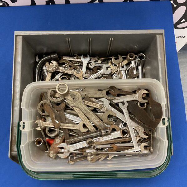 Assortment of vintage hand tools including wrenches and pliers.