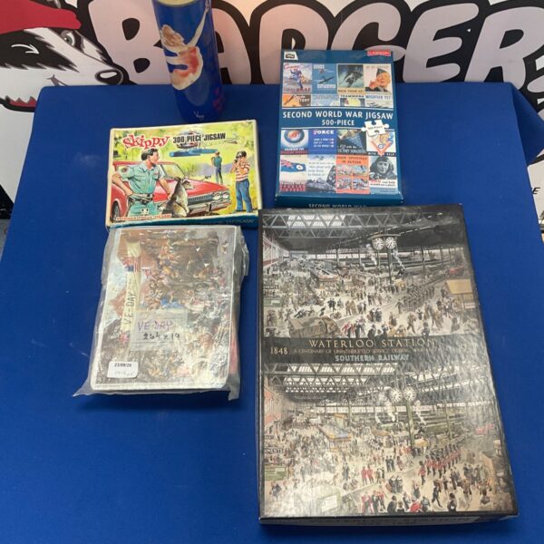 Vintage jigsaw puzzle lot including Waterloo Station and WWII Lagoon.