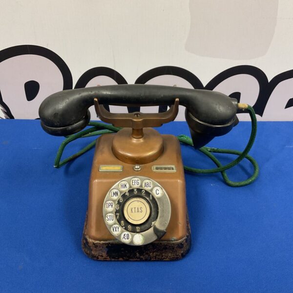 Vintage Ktas Danish rotary telephone with copper finish.