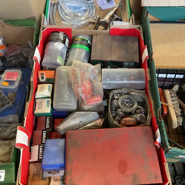 Assorted vintage light bulbs in a cardboard box.