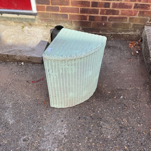 Vintage Lloyd Loom linen basket, woven wicker corner storage solution.