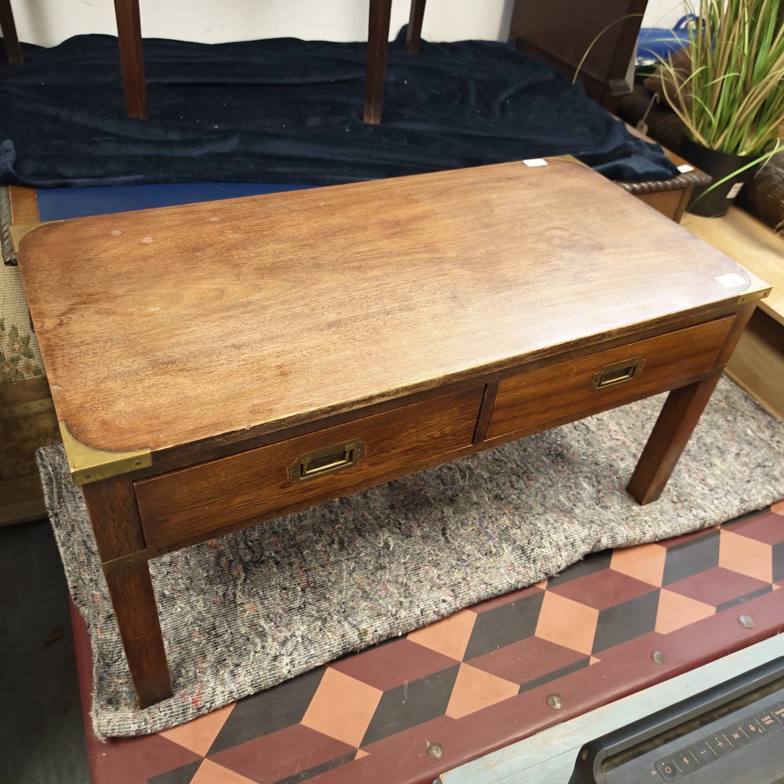 Vintage mahogany coffee table with brass fittings and drawer.