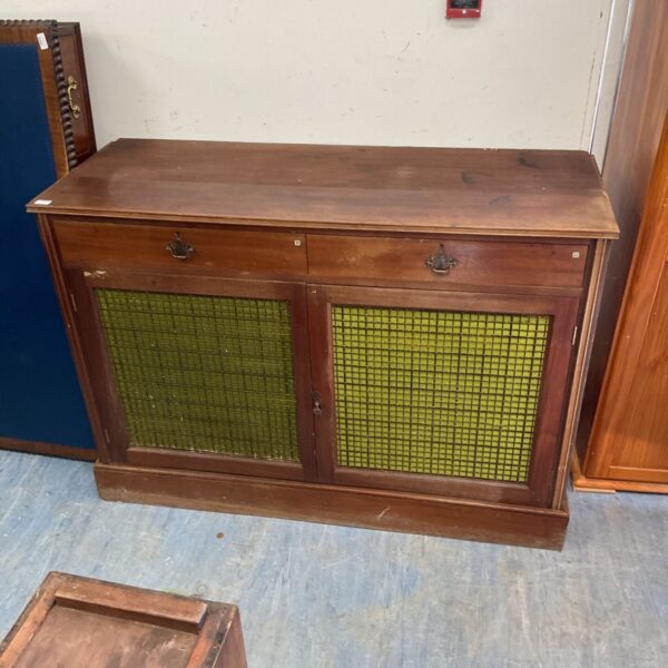 Vintage mahogany larder with mesh doors, ideal for kitchen storage.