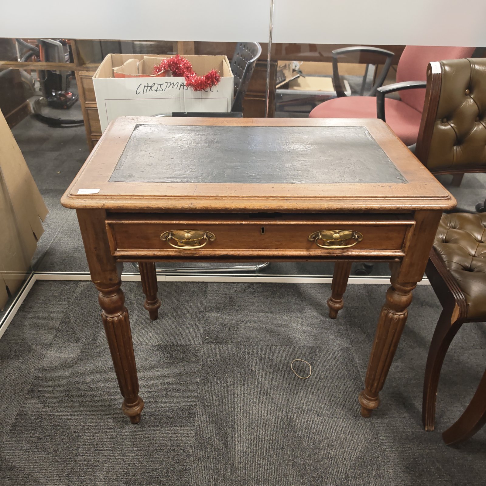 Vintage mahogany writing desk with leather top and drawer.