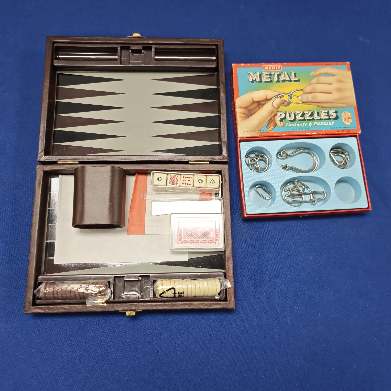 Vintage Merit metal puzzle set in original packaging.