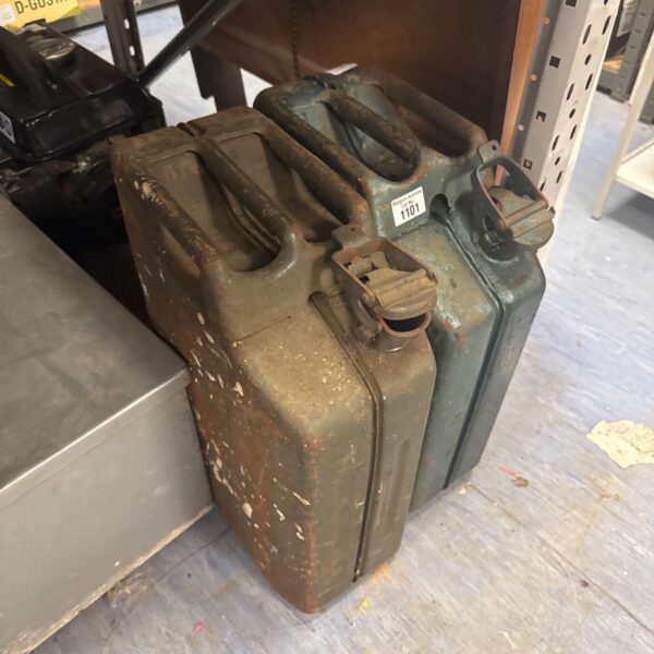 Vintage 20L metal jerry can with signs of wear.