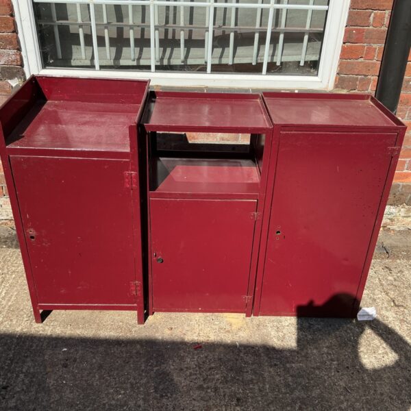 Vintage metal storage cabinet with a single door and locking mechanism.