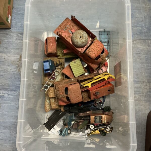 Lot of vintage metal toy trucks and cars with rust.
