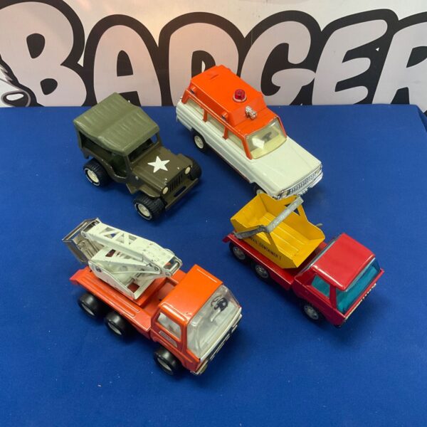 Lot of four vintage metal toy vehicles, including a Tonka truck.