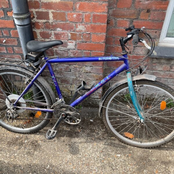 Blue vintage M.G.i. Alternative mountain bike with rear rack.