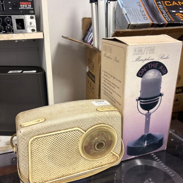 Vintage TP-330 microphone radio on a table.