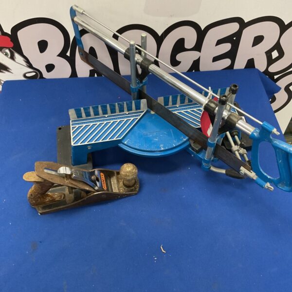 Vintage mitre saw and Stanley smoothing plane for woodworking.