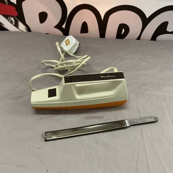 Vintage Moulinex meat carver in cream and black, retro kitchen appliance.