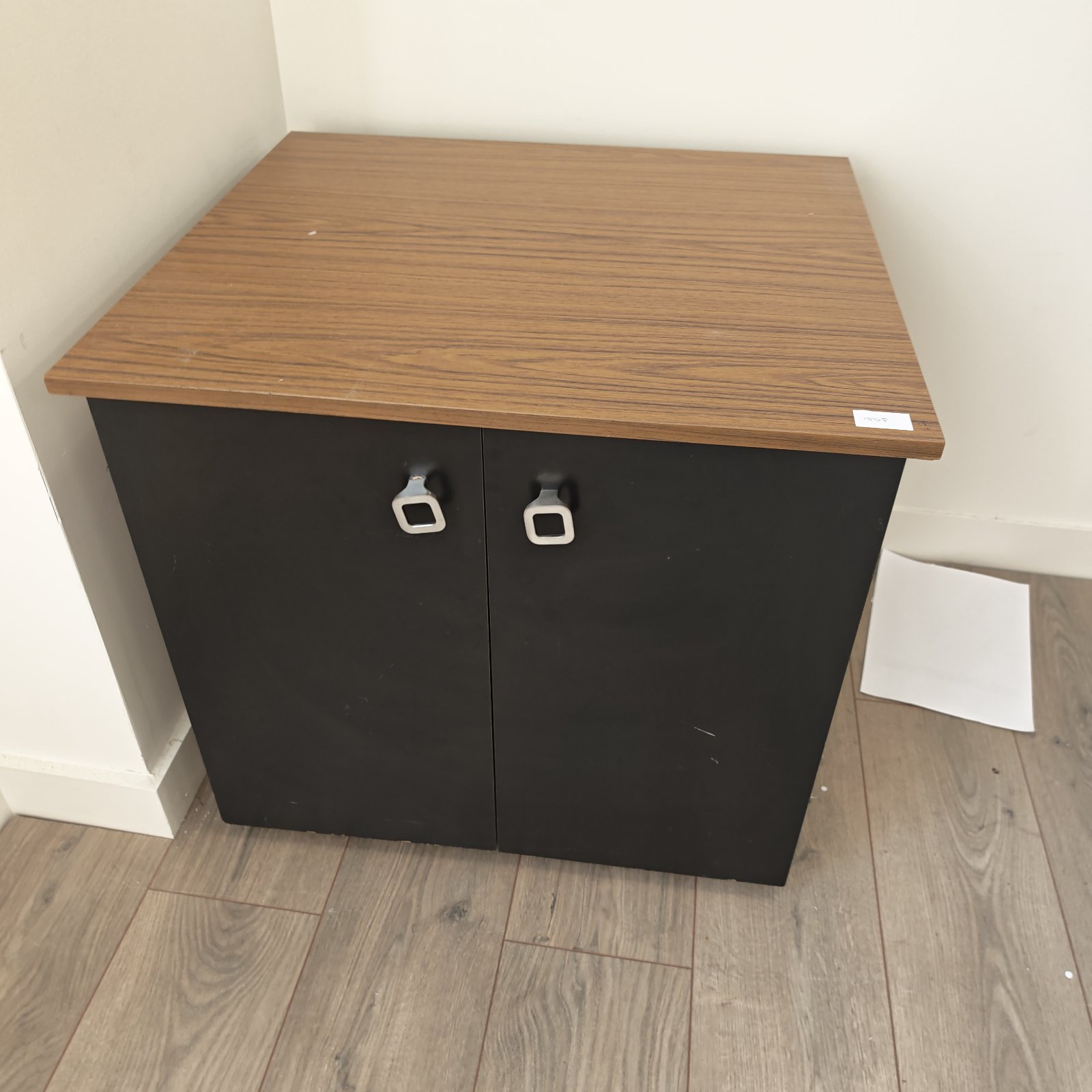 Vintage office storage cabinet with wood laminate top.