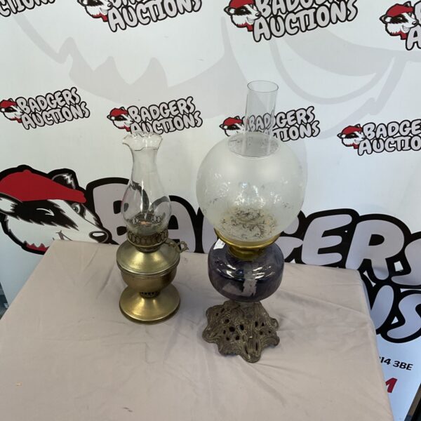 Vintage brass oil lamp with clear glass shade.