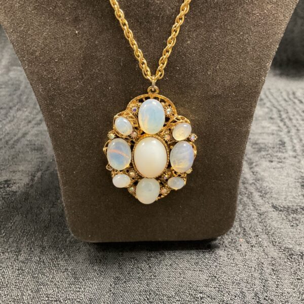 Vintage opaline pendant necklace with gold tone chain and filigree.