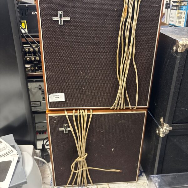 Vintage Philips High Fidelity International loudspeakers in a cluttered workshop.