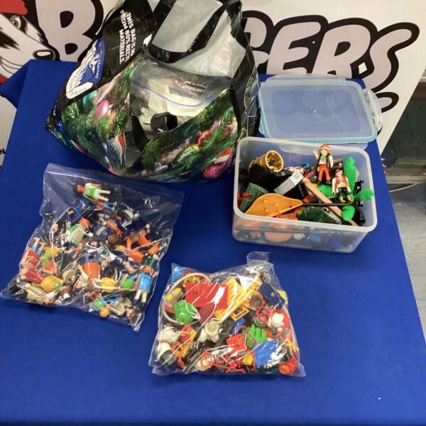 Vintage Playmobil toys lot including pirate figures and modern characters.