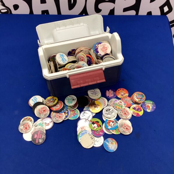 Vintage Pog collection in a lunchbox, 1990s nostalgia.