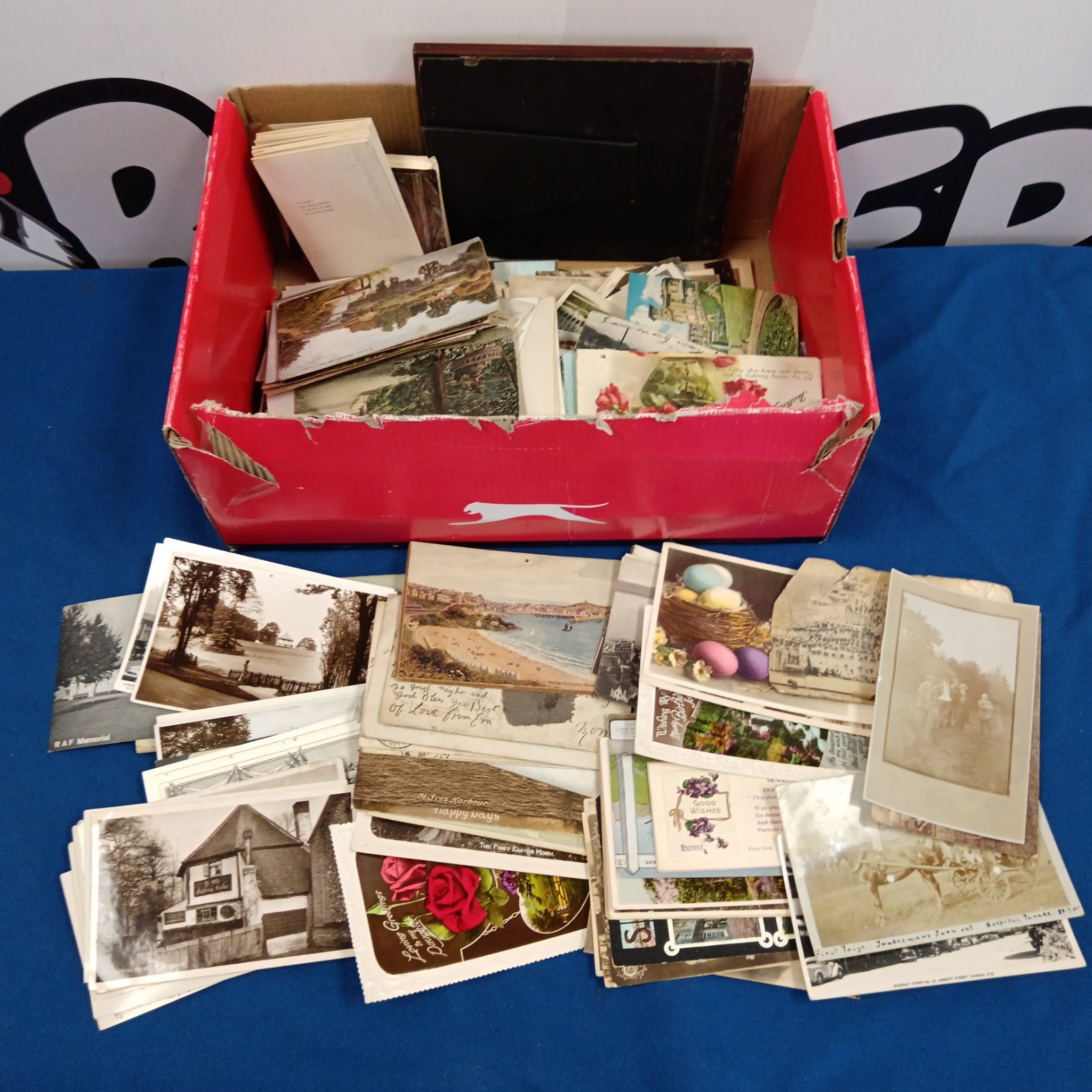 Vintage postcard collection with various scenes and photographs.
