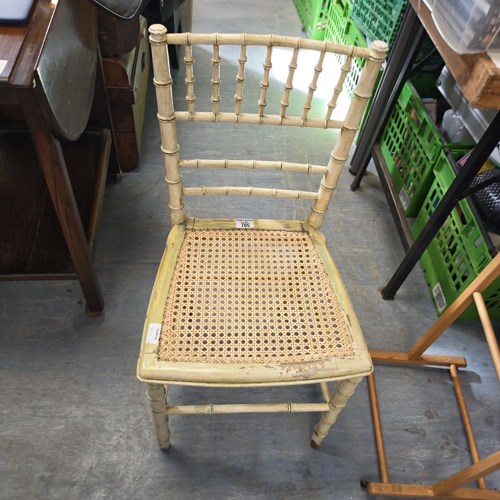 Vintage rattan chair with woven seat and bamboo frame.