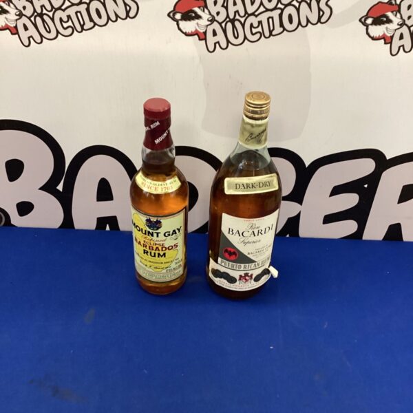 Vintage Mount Gay and Bacardi rum bottles, collectible spirits.
