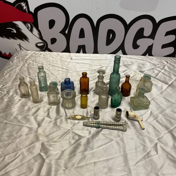 Vintage scent bottles with stoppers, a collectible glass bottle assortment.