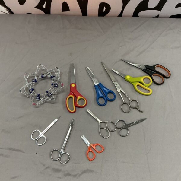 Vintage scissors lot with varied handle designs and blade finishes.