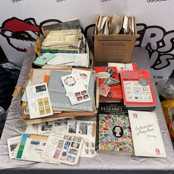 Vintage stamp collection with stamp collecting books displayed.