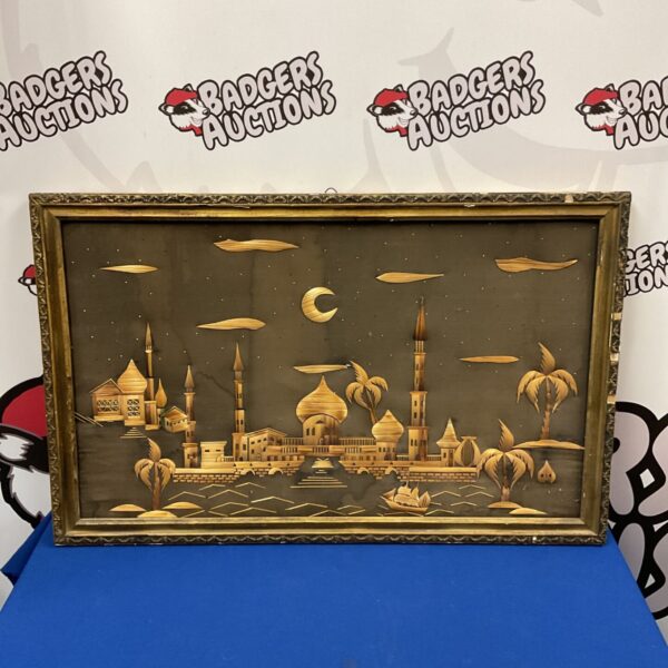 Vintage straw mosaic picture of a Middle Eastern riverside scene.