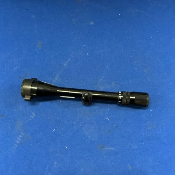 Vintage telescopic sight with adjustable focus, ideal for collectors.