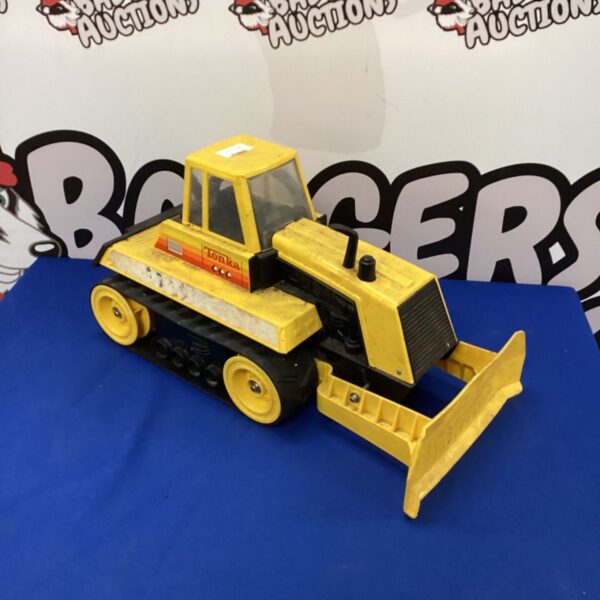 Vintage Tonka bulldozer, yellow metal construction toy, collectible.