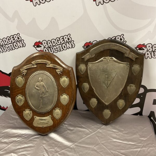 Vintage oak shield trophy plaques, 1939-1958, collectible sporting awards.