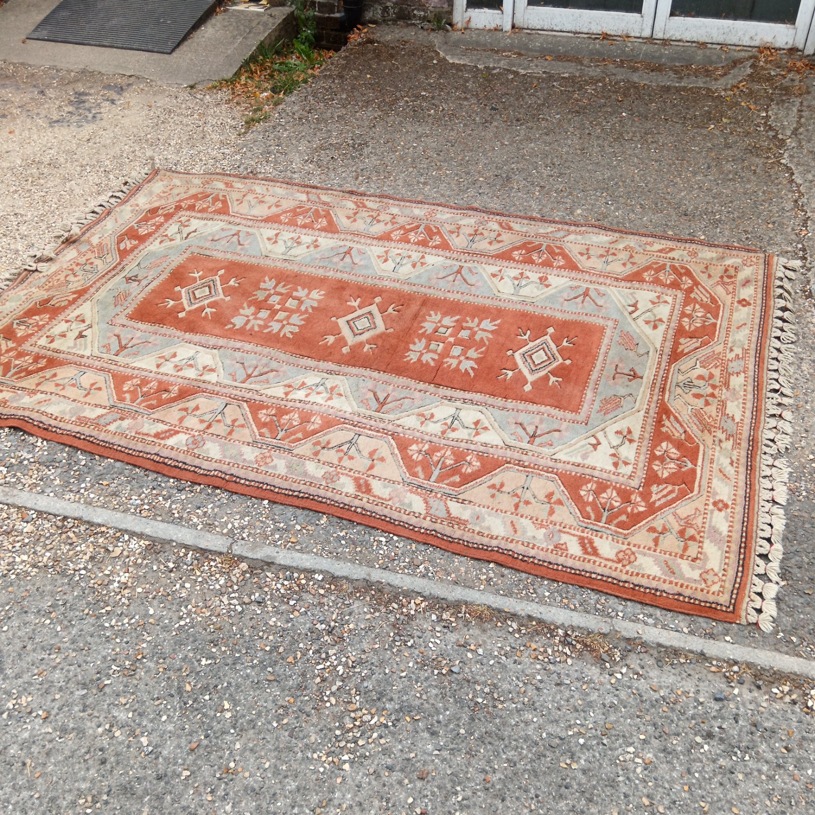 Vintage Turkish Milas rug with geometric patterns in red and cream.