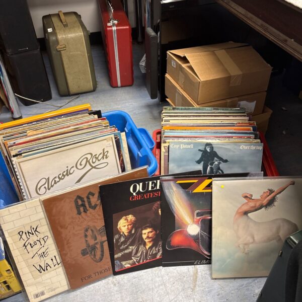 Vintage vinyl records lot including Pink Floyd and AC/DC albums.