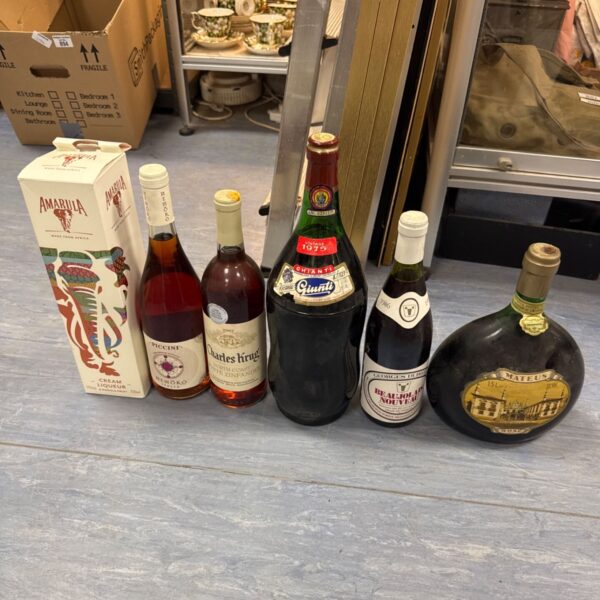 Vintage wine and spirits lot including Amarula and Chianti bottles.