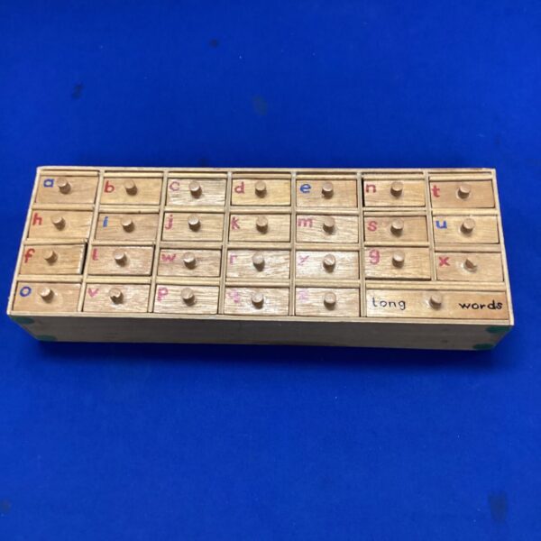 Vintage wooden alphabet organiser with letter compartments.