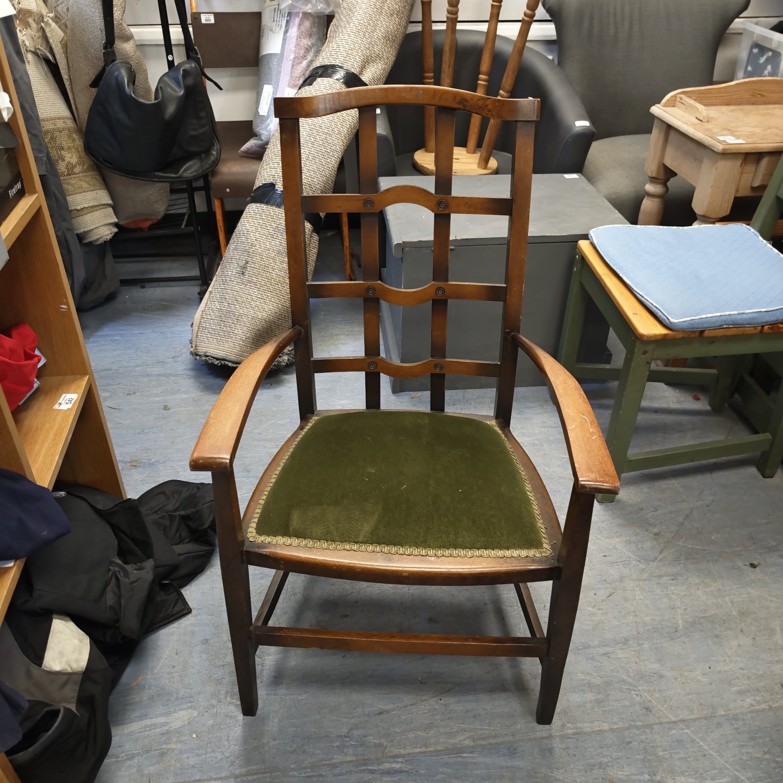 Vintage wooden armchair with olive green velvet seat and ladder back.