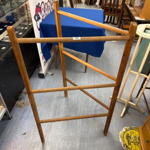 Vintage wooden clothes airer for drying laundry, rustic style.