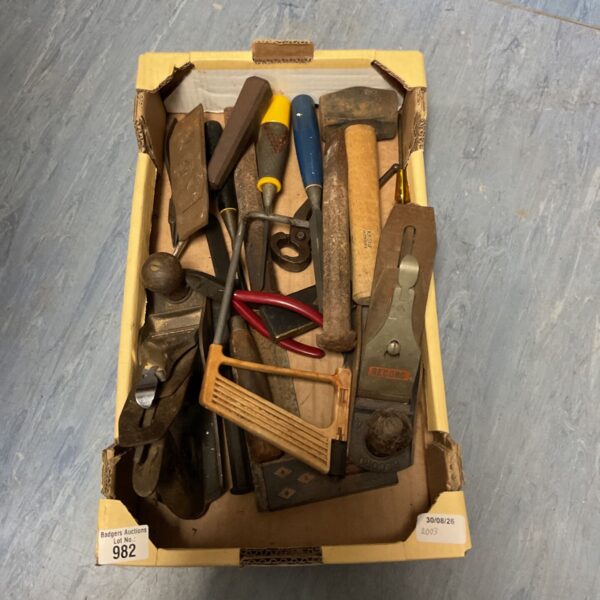 Vintage woodworking tools lot including chisels and planes.