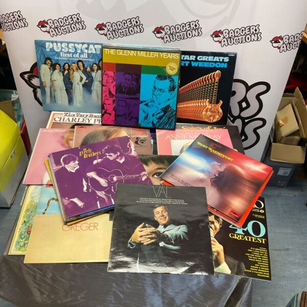 Vintage vinyl LP collection including Glenn Miller and Everly Brothers records.