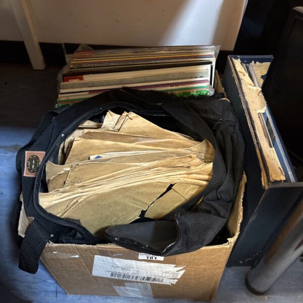 Mixed lot of vinyl records in a black carry case and cardboard box.