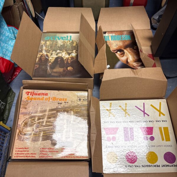 Stack of boxes filled with vinyl records, a mixed record lot.