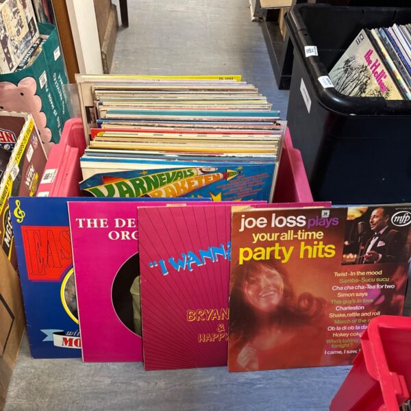 Stack of vintage 12 inch vinyl records including Joe Loss and Nick Records.