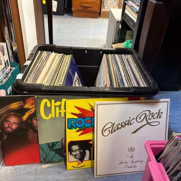 Box of vintage vinyl records including rock albums.