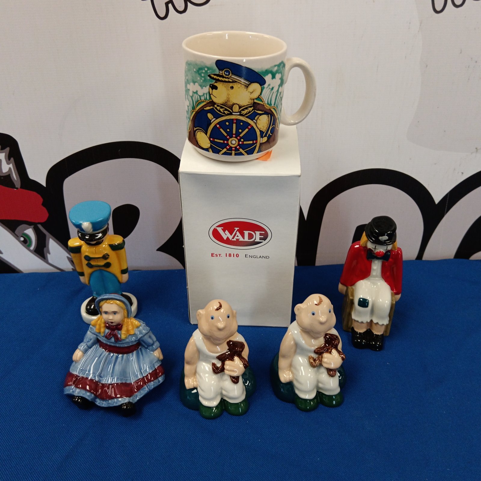 Lot of five Wade porcelain figures including Emily doll and Chuckles the clown.