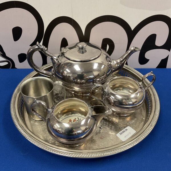 Walker & Hall silver plate tea set with teapot, sugar bowl, and tray.