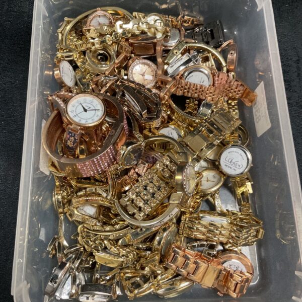 Tray of broken wristwatches for spares and repair.
