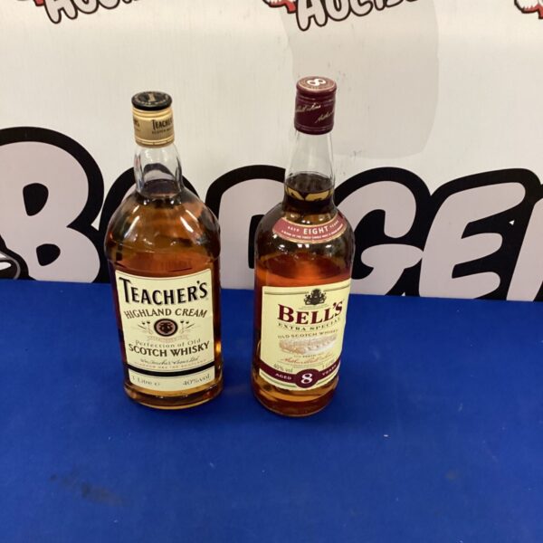 Two litre bottles of Bell's 8 Year Old and Teacher's Highland Cream whisky.