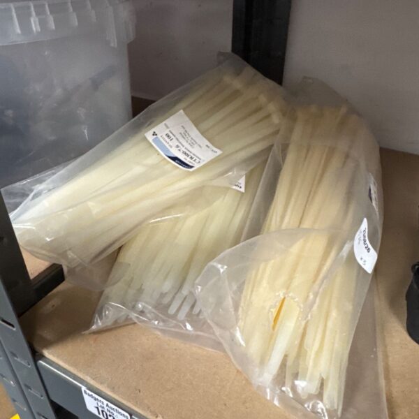 White plastic cable ties lot for wire management and organization.